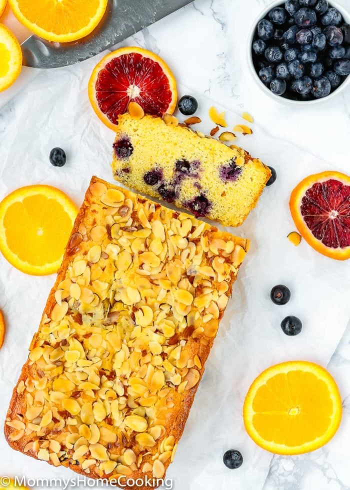 Sweet Eggless Orange Blueberry Corn Bread loaded with blueberries and sprinkled with almonds. The corn-citrus combination is so yummy and perfect for breakfast or snack time. Totally irresistible! https://mommyshomecooking.com