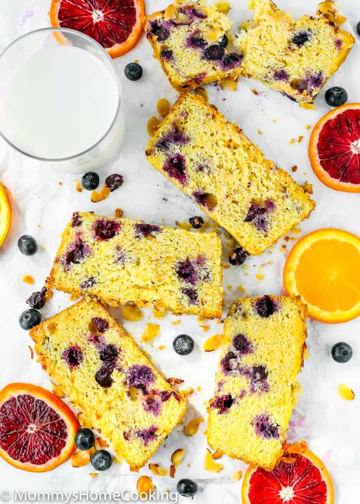 Sweet Eggless Orange Blueberry Corn Bread loaded with blueberries and sprinkled with almonds. The corn-citrus combination is so yummy and perfect for breakfast or snack time. Totally irresistible! https://mommyshomecooking.com