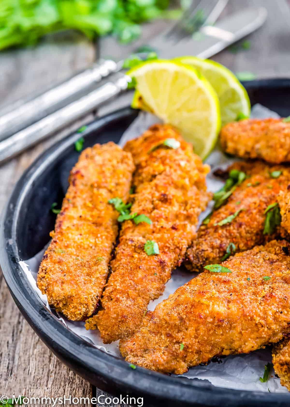 Eggless Oven Fried Chicken Tenders on a black plate