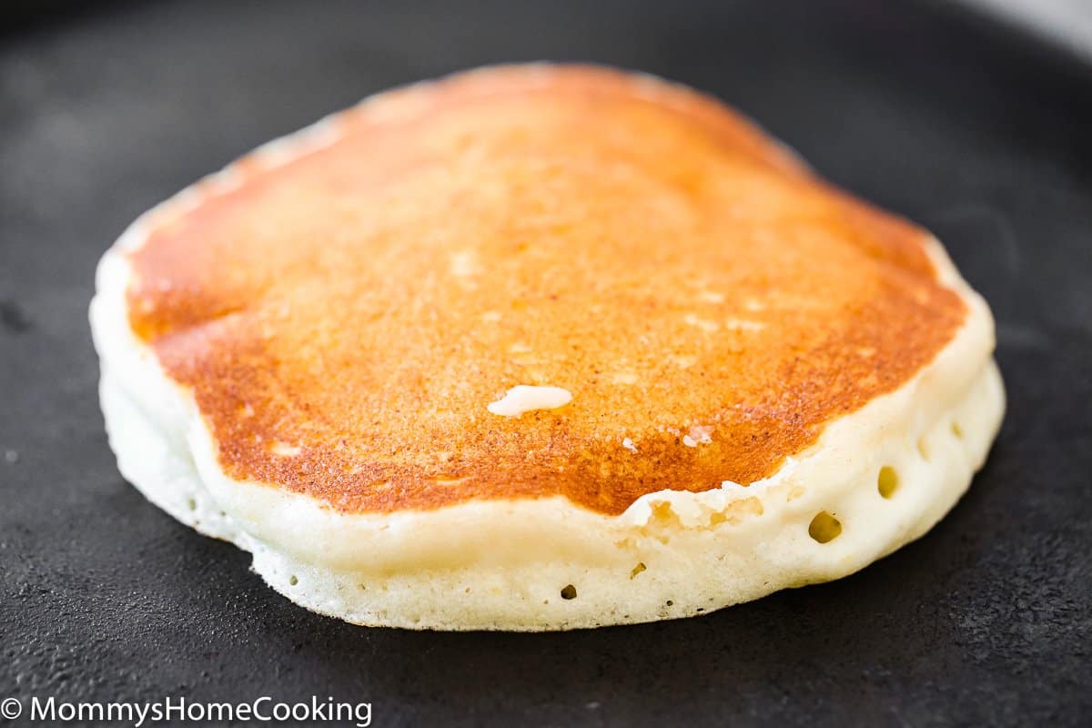 Eggless Pancake cooking on a skillet