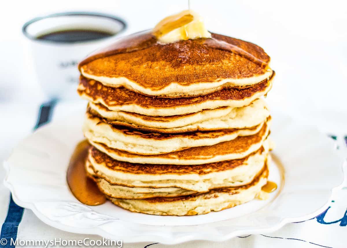 Eggless Pancakes on a plate with syrup