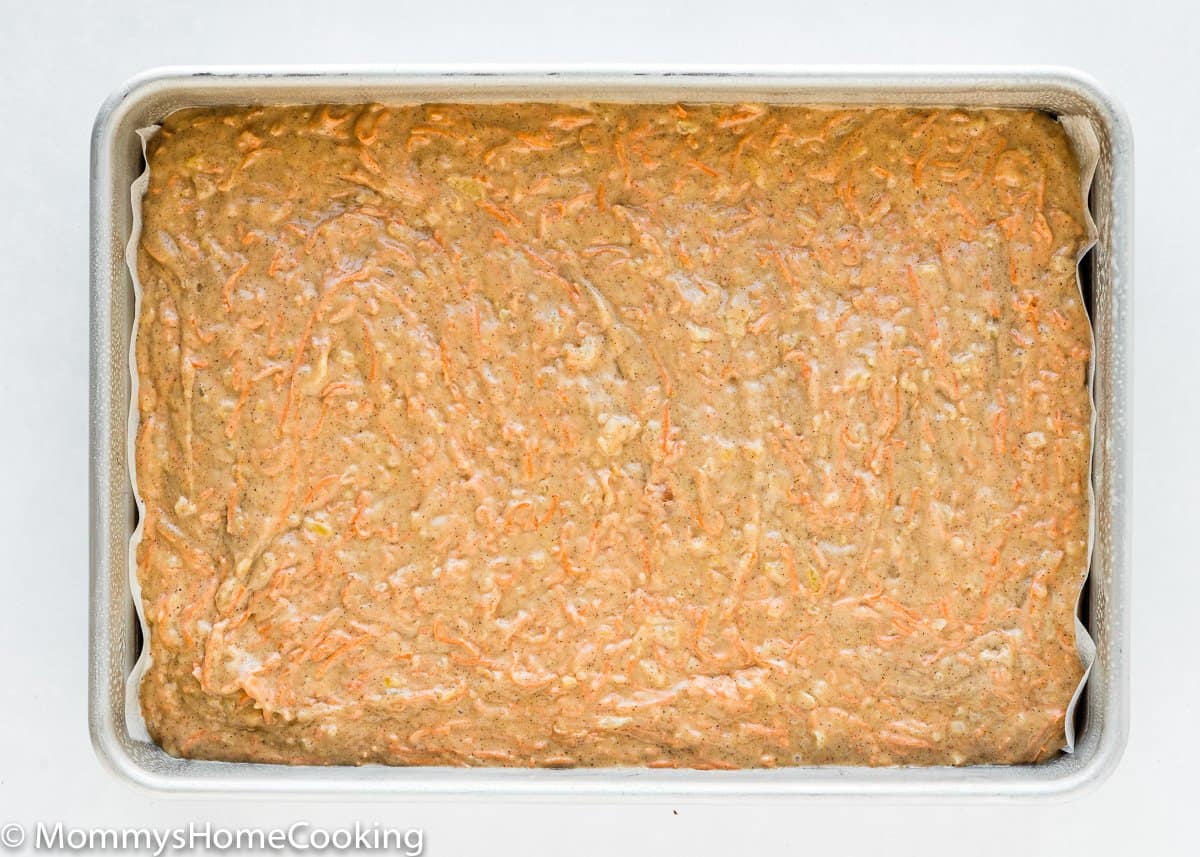 egg-free pineapple carrot cake batter in a rectangular cake pan.