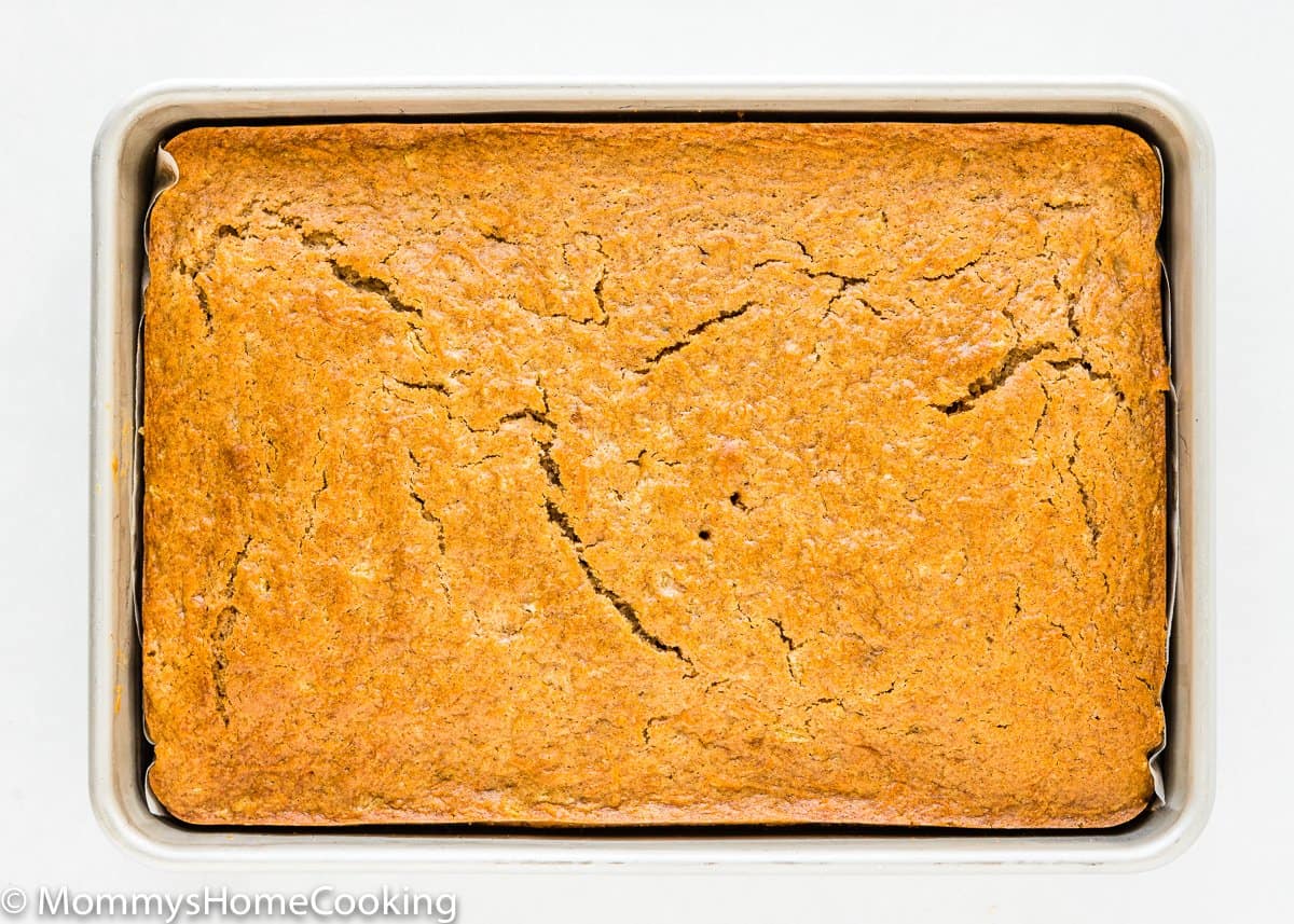 whole egg-free pineapple carrot cake in a rectangular cake pan.