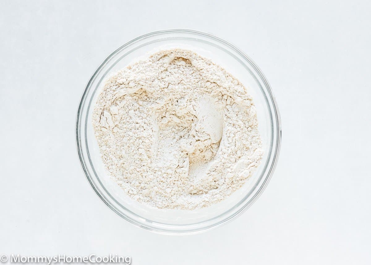 dry ingredients to make egg-free pineapple carrot cake in a bowl mixed together.