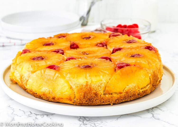 Eggless Pineapple Upside Down Cake over a serving plate.