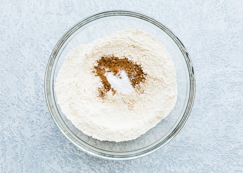 dry ingredients needed to make egg-free pumpkin cake in a bowl.