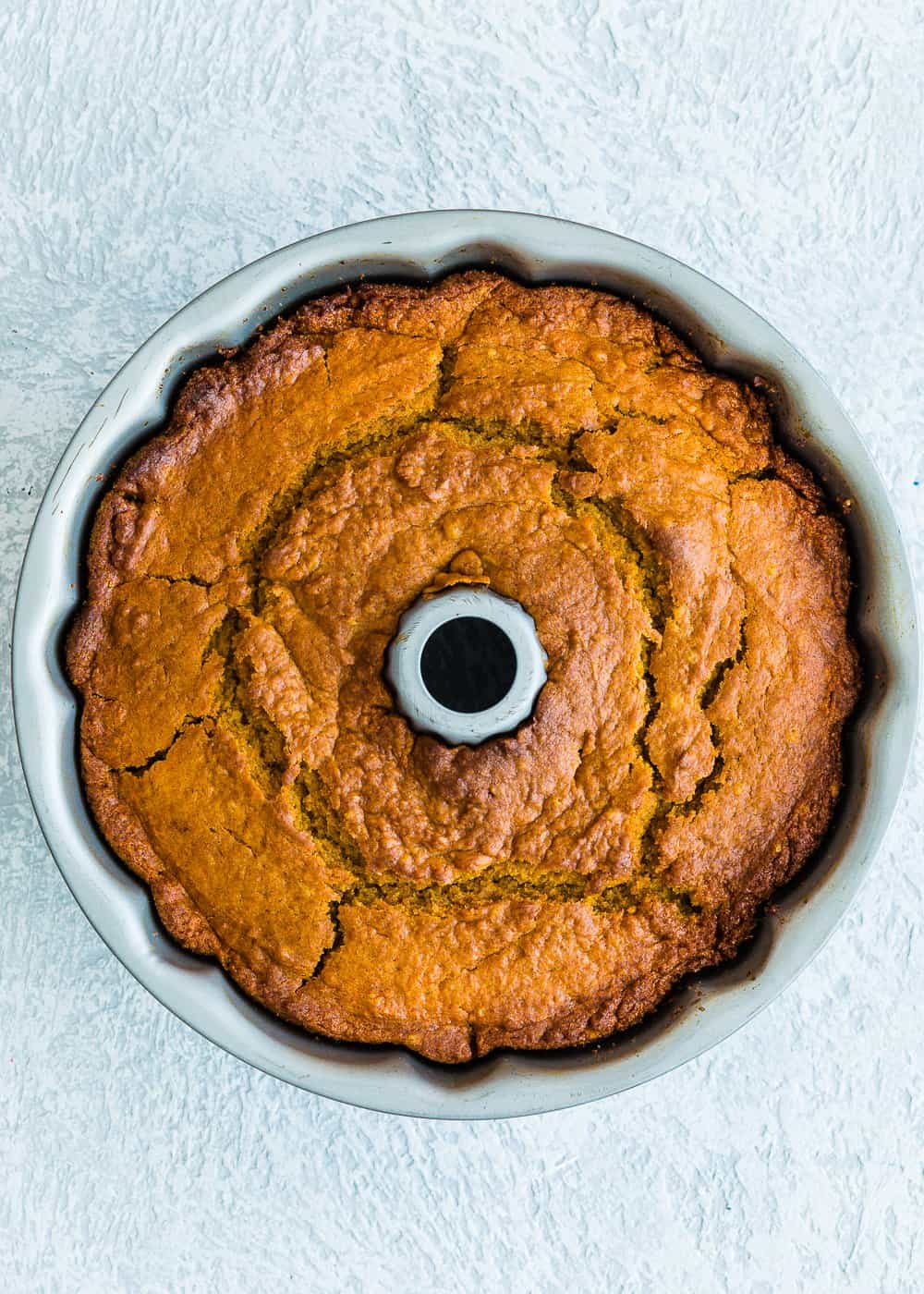 baked eggless pumpkin cake in a bundt pan.