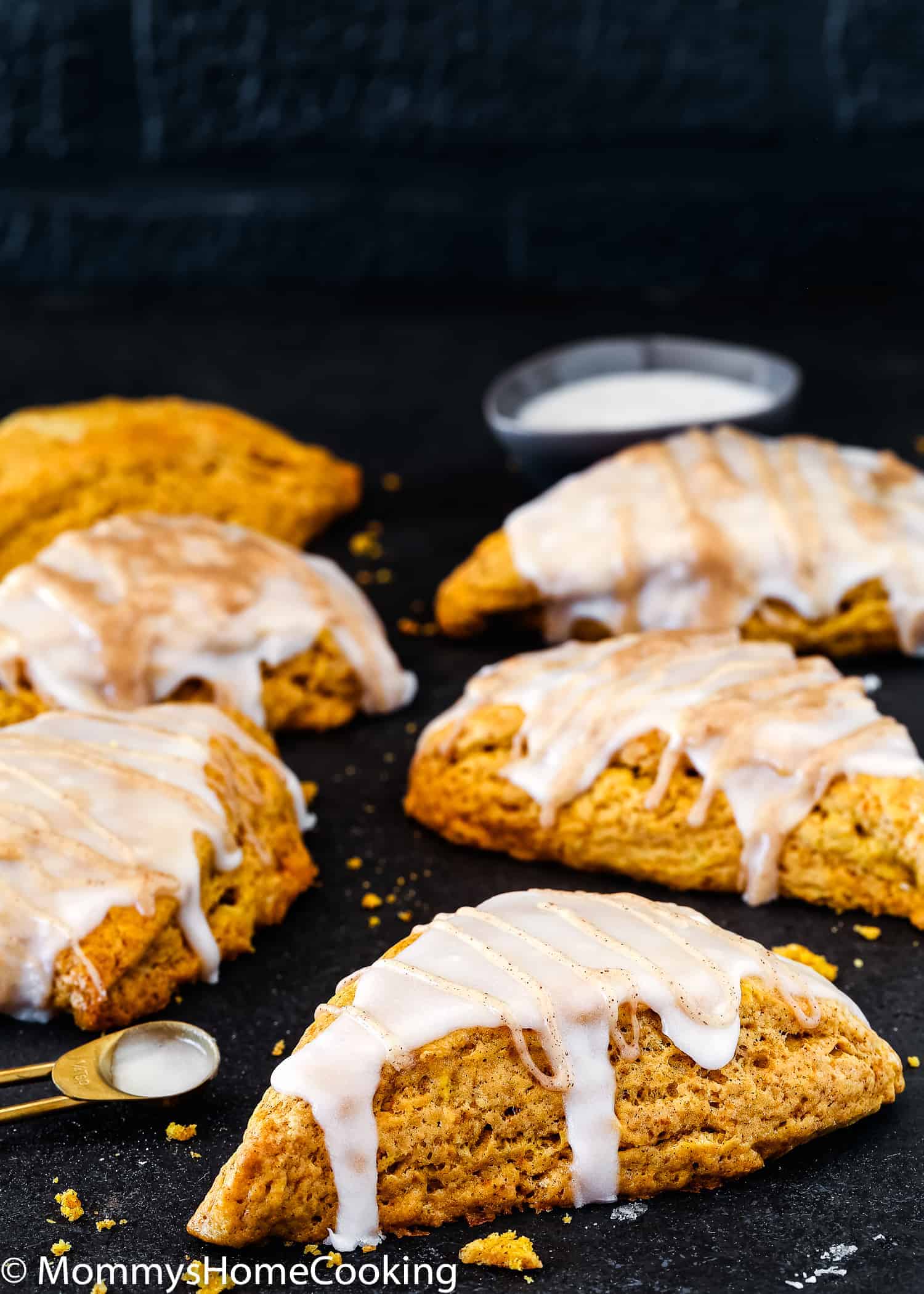 Eggless Pumpkin Chai Scones drizzle with sugar glaze.