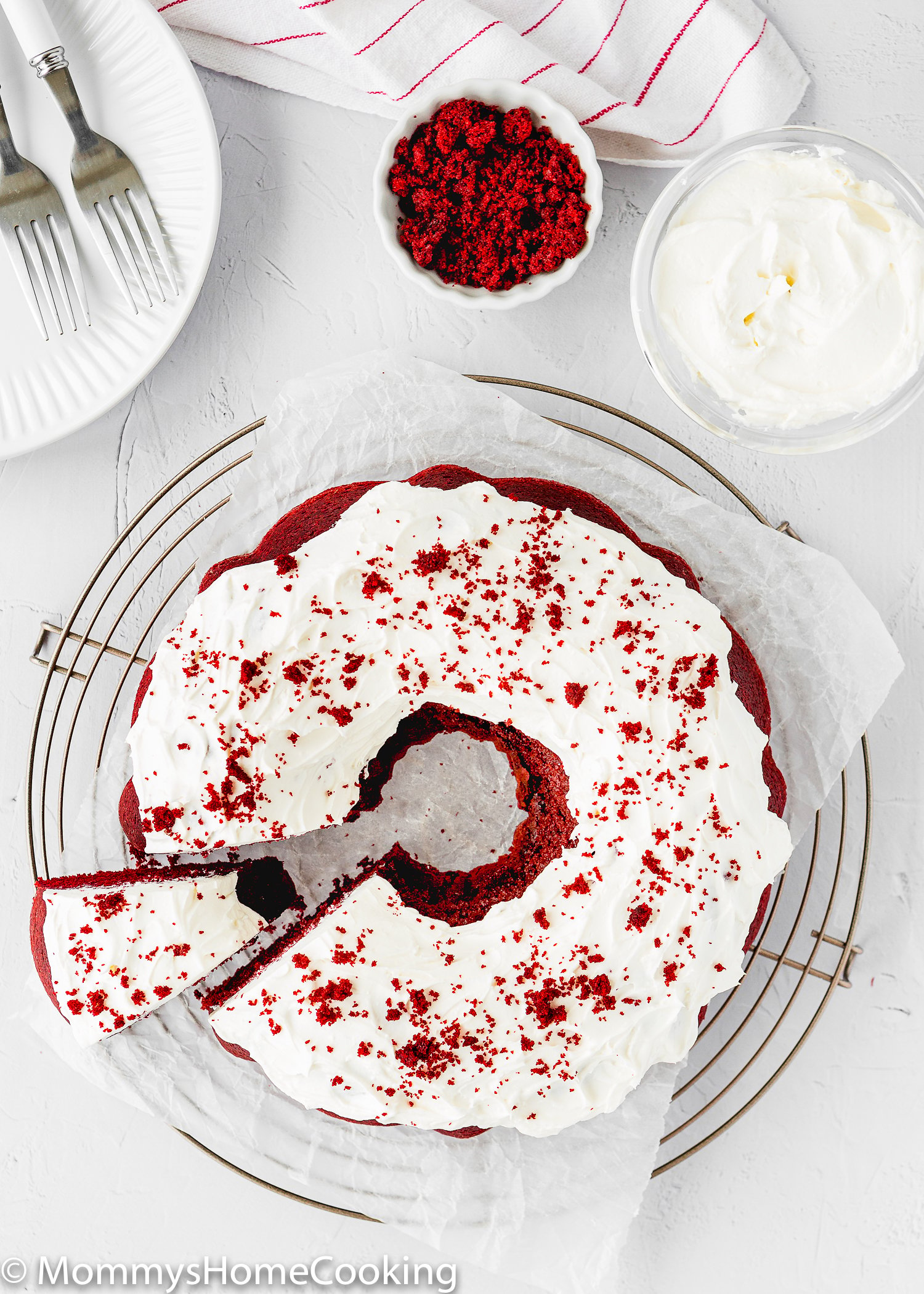 Eggless Red Velvet Bundt Cake sliced over a metal rack.