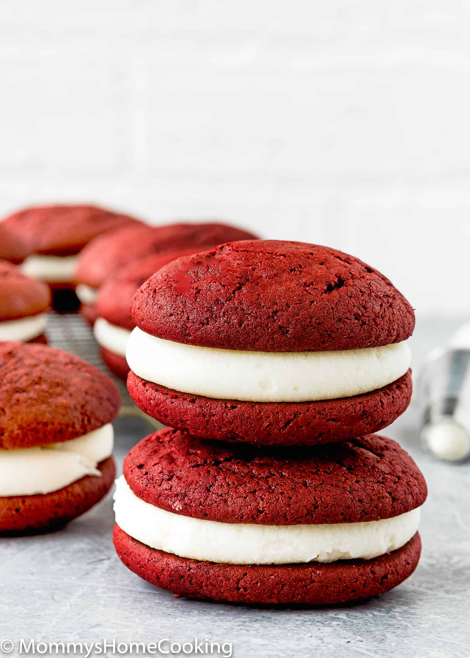 two Eggless Red Velvet Whoopie Pies with cream cheese frosting