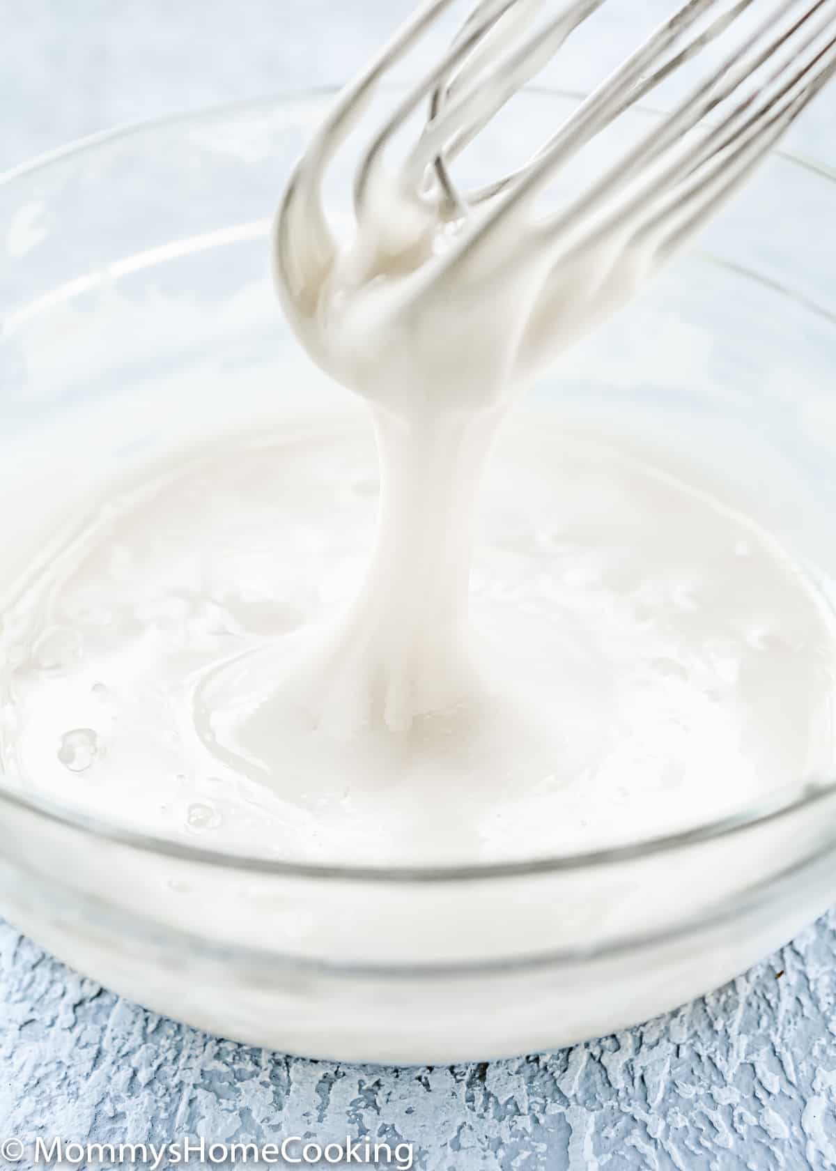 Eggless Royal Icing in a bowl with a whisk