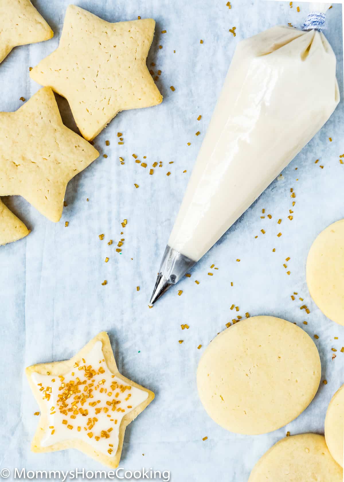 eggless sugar cookies with a eggless royal icing in a piping bag