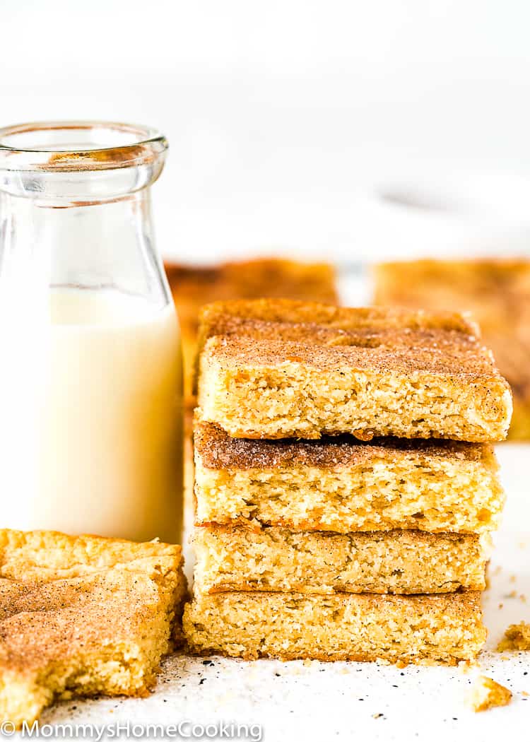 Stack of Eggless Snickerdoodle Bars with a glass of milk