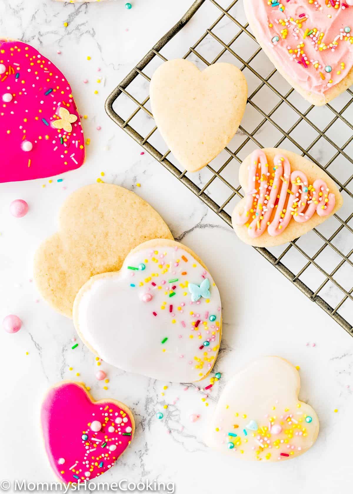overhead view of Eggless Sugar Cookies over a marble surface.