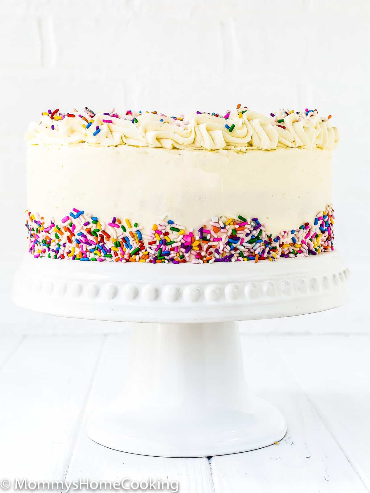 eggless vanilla cake in a cake stand