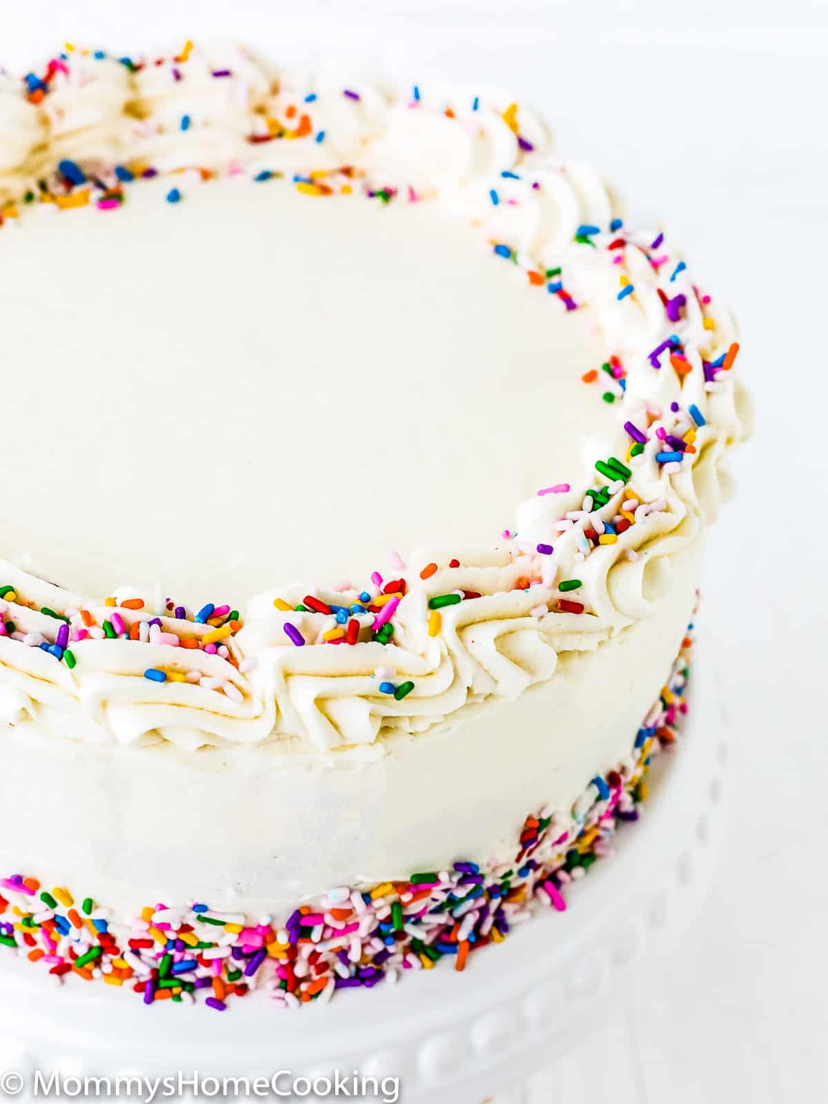 eggless vanilla cake with buttercream and sprinkles