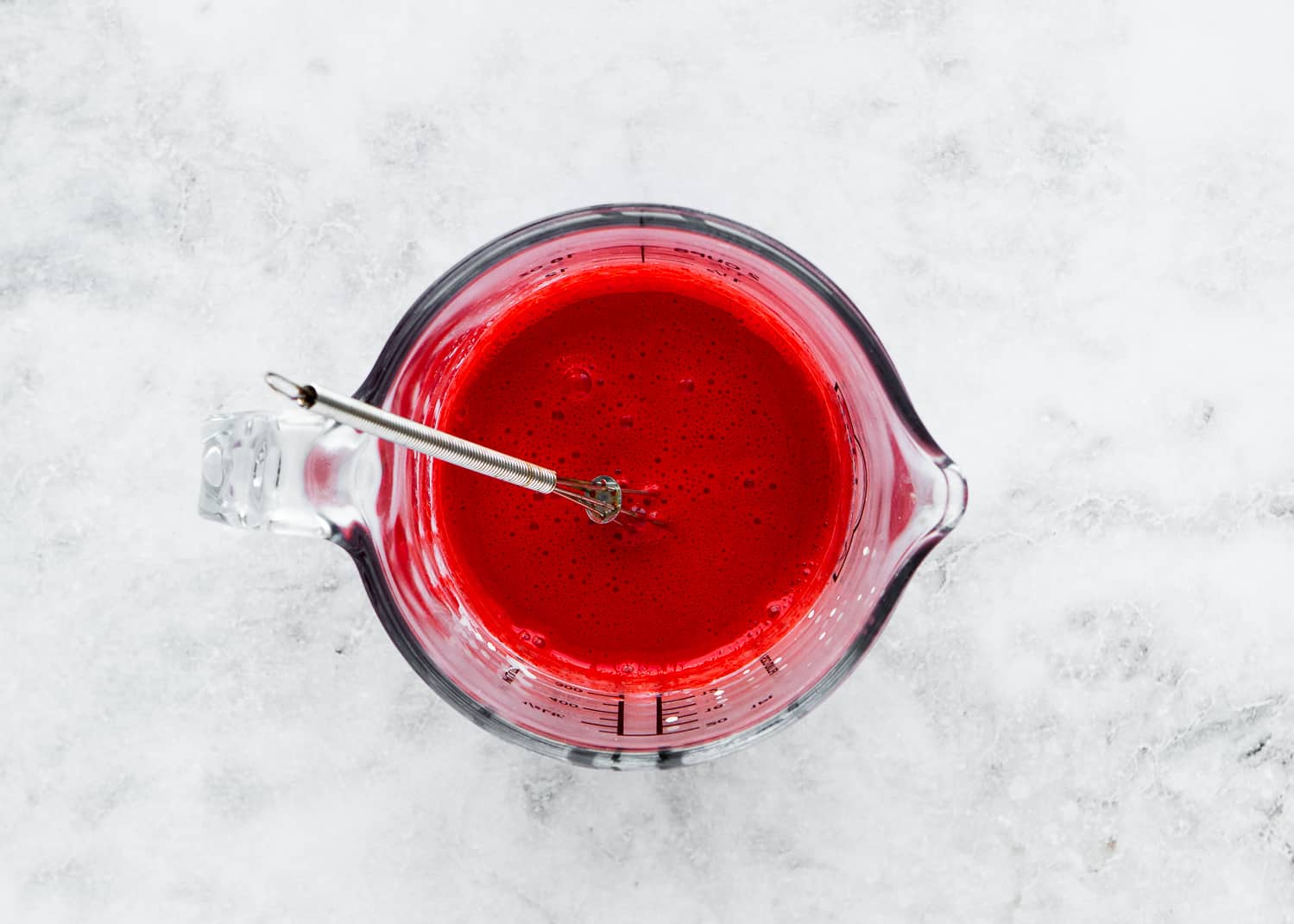 milk, vinegar, yogurt, melted butter, vanilla and red food color mix together in a bowl