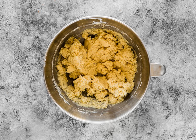 Eggless Halloween Cookies dough in a stand mixer bowl. 