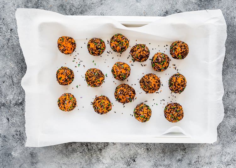 egg-free sugar halloween cookies covered with halloween sprinkles. 