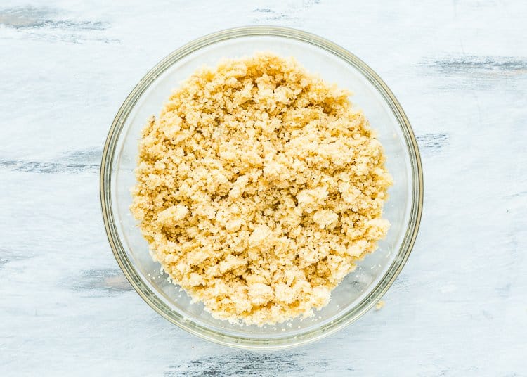 Crumbled Eggless Homemade Cake in a bowl.