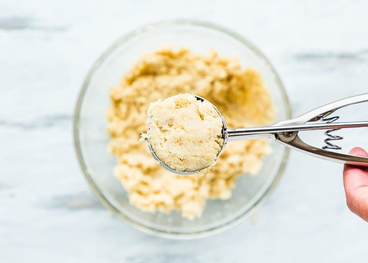 Eggless Homemade Cake pop mixture in a ice cream scoop.