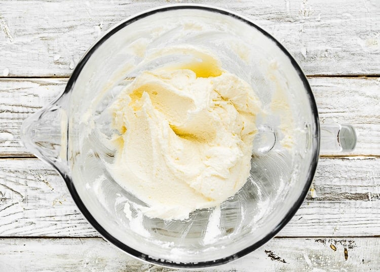 butter and sugar creamed together in a mixing bowl.