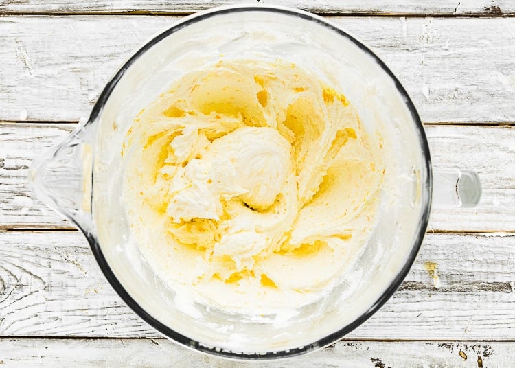 butter and sugar creamed together in a mixing bowl.