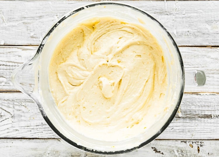 egg-free orange cake batter in a mixing bowl. 