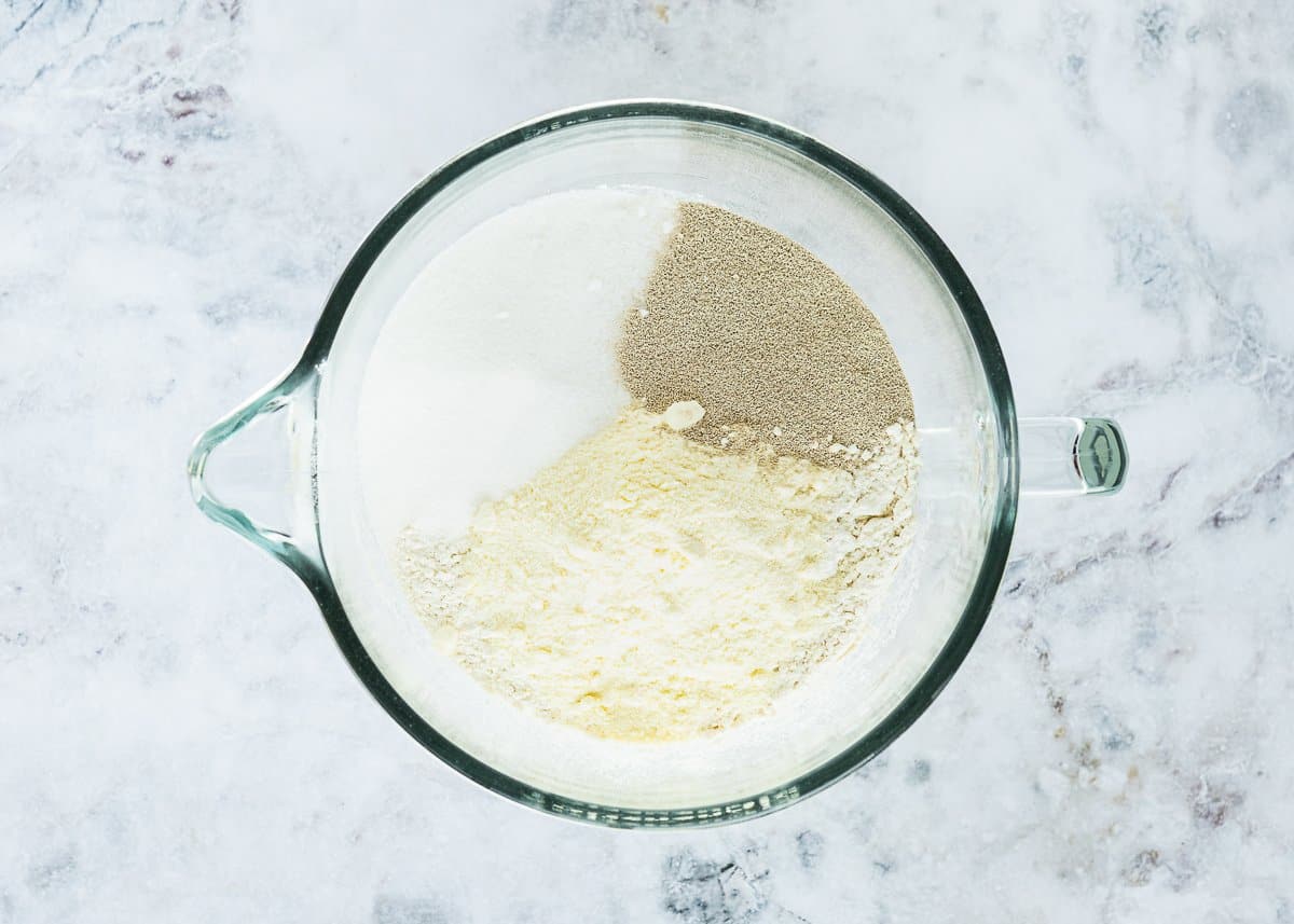 dry ingredients needed to make egg-free brioche in a stand mixer bowl. 