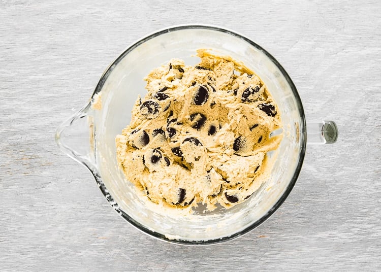 egg-free chocolate chip cookie dough in a bowl of a stand mixer. 