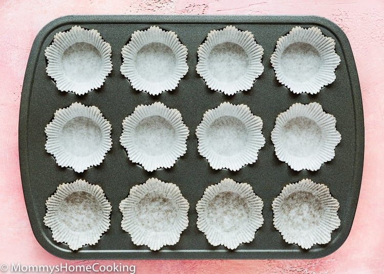a cupcakes pan with cupcakes linners. 
