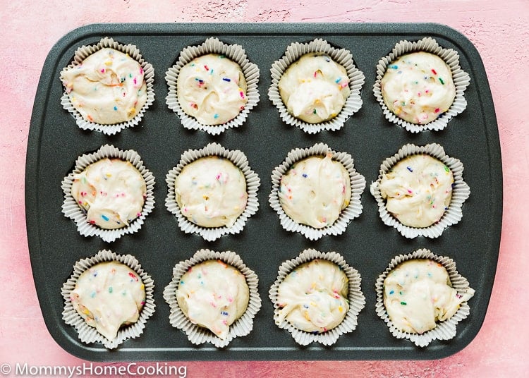 a cupcakes pan filled with cupcakes batter. 
