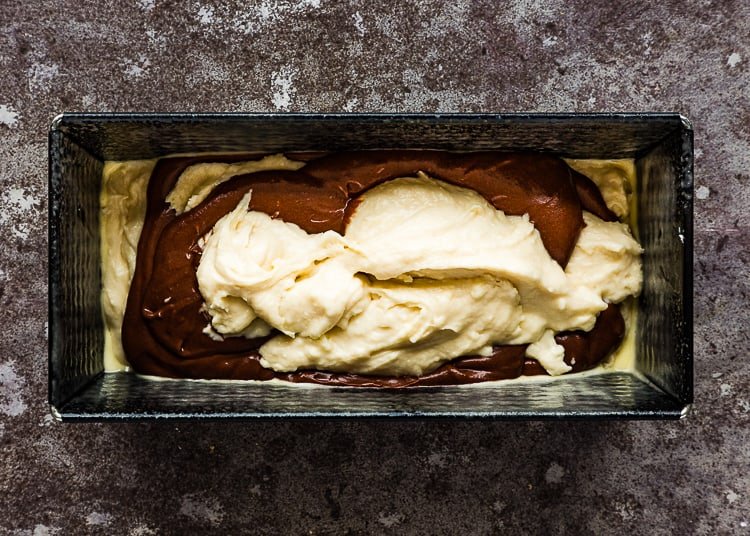 eggless vanilla and chocolate cake batter in a loaf pan. 