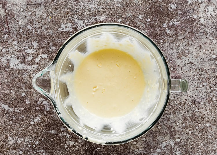 wet ingredients needed to make egg-free cake in a mixer’s bowl. 