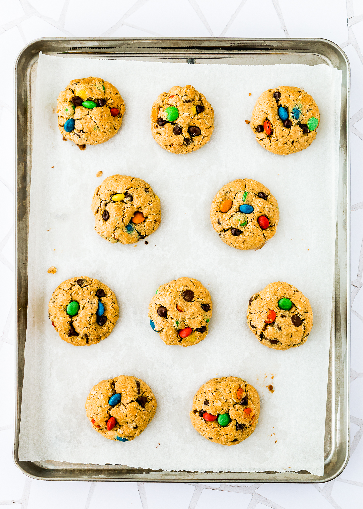 Baked Eggless Monster Cookies on a baking tray. 