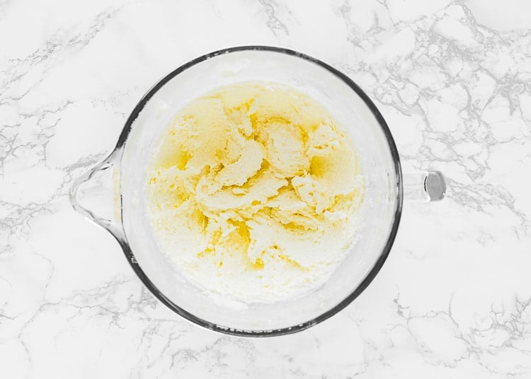 butter and sugar creamed together in a bowl of a stand mixer. 