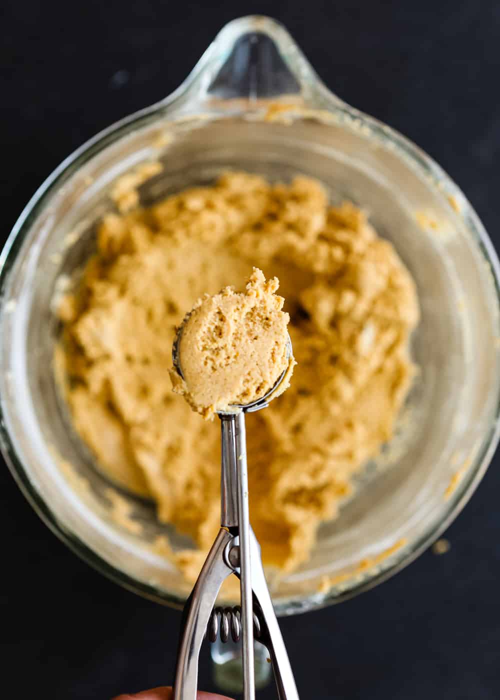 Eggless Pumpkin Snickerdoodles Dough in a cookie scoop