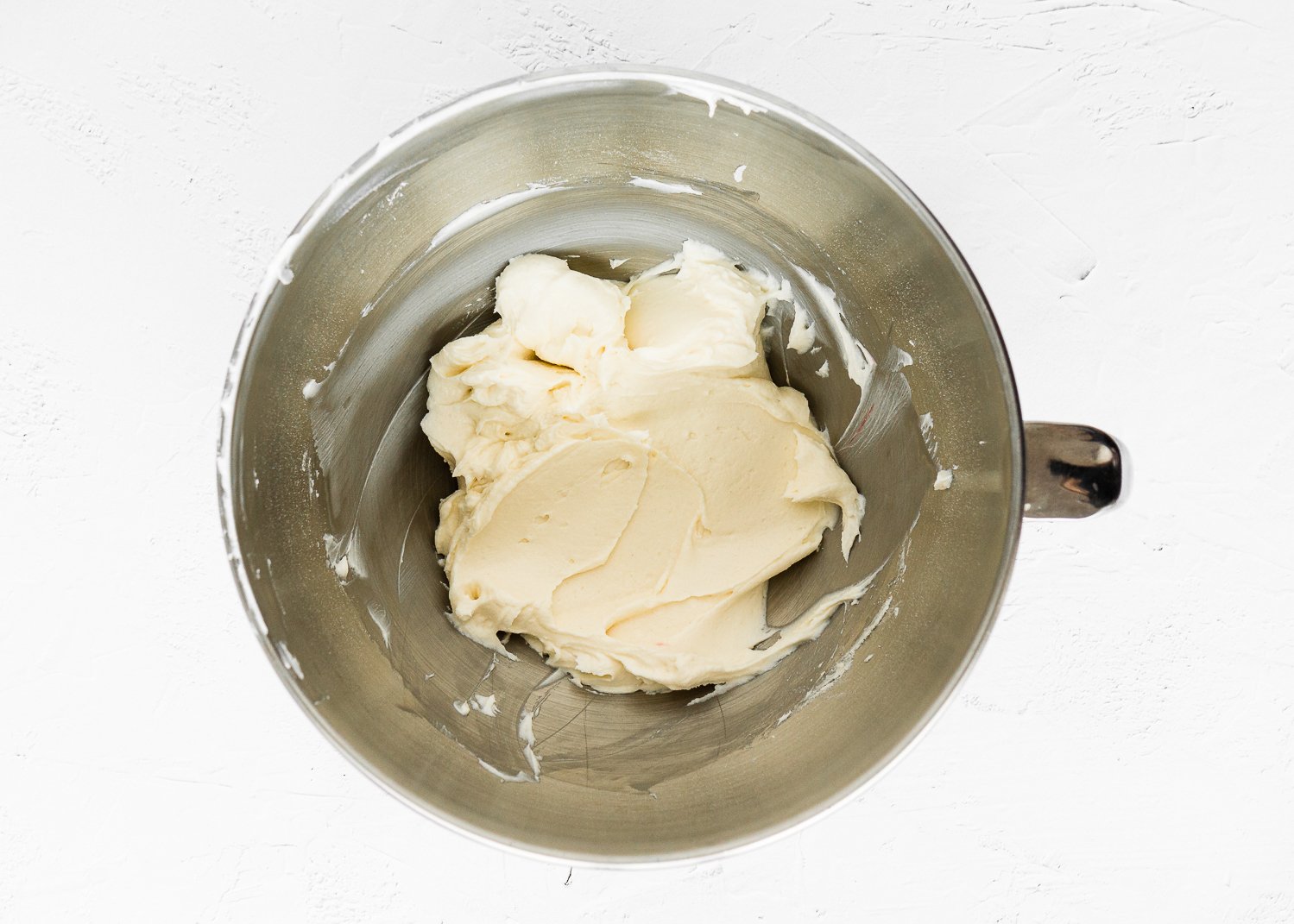 butter creamed in a mixing bowl.