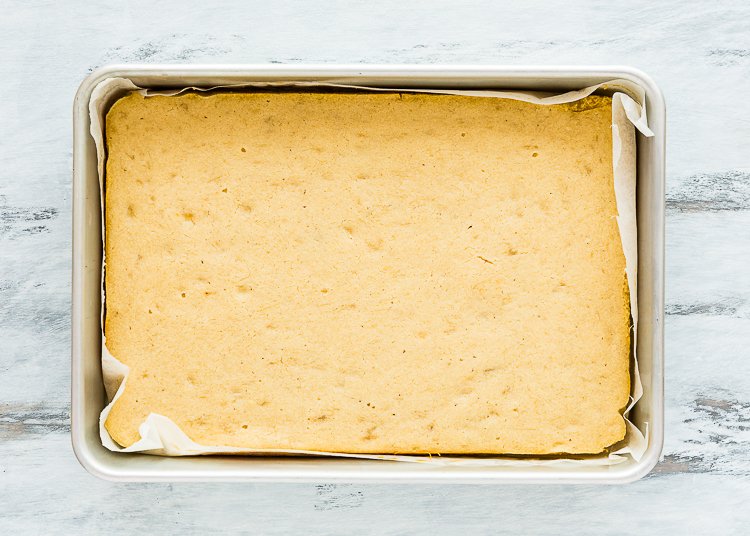 baked eggless cake in a rectangular cake pan. 