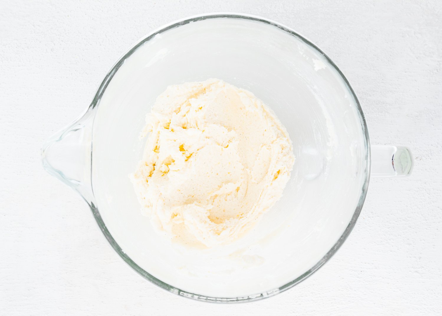 sugar and butter cream in a mixing bowl