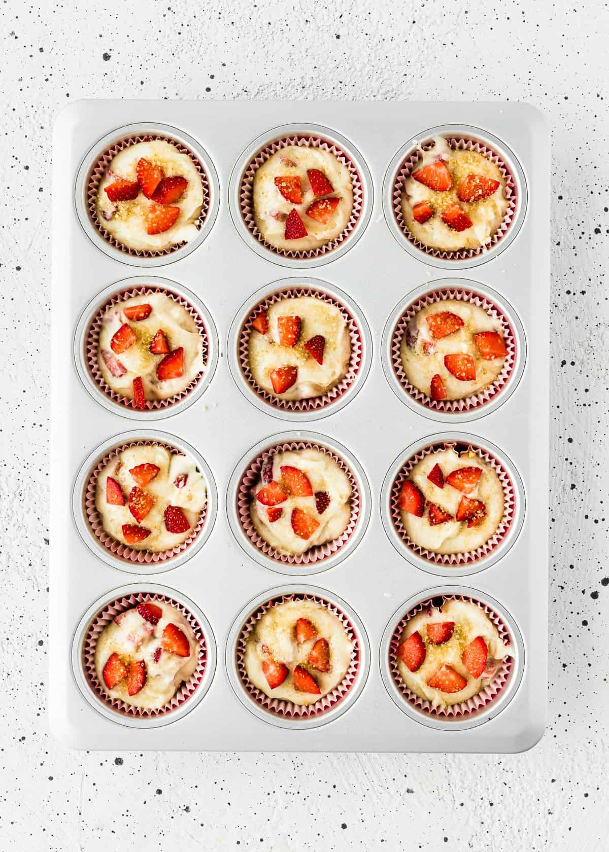 unbaked egg-free strawberry muffins in a muffin pan. 