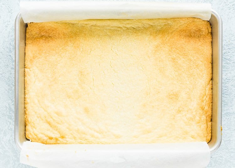 baked egg-free lemon bar crust in a baking pan. 