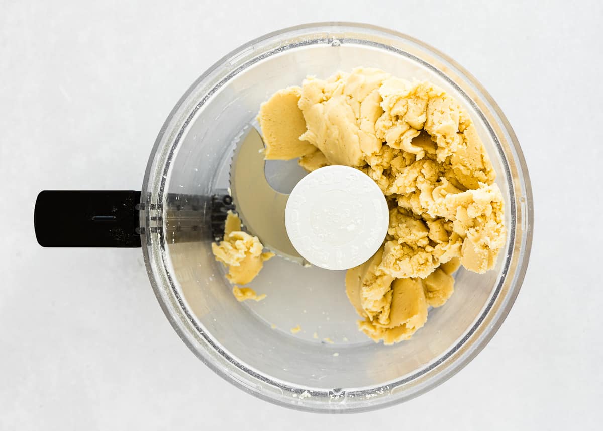 eggless tart dough in a food processor bowl.