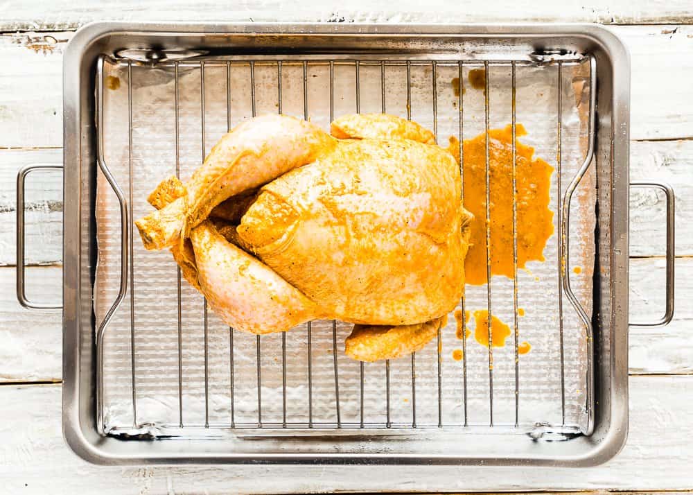 marinated Venezuelan chicken in a roasting pan.