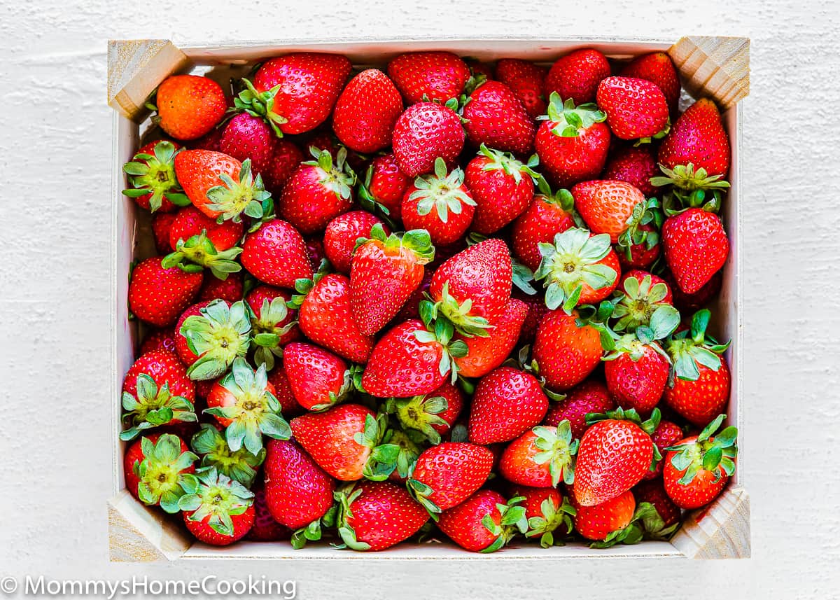 fresh strawberries in a wooden basket.