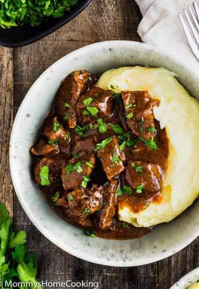 Beef Tips with Gravy and mashed potatoes in a bowl