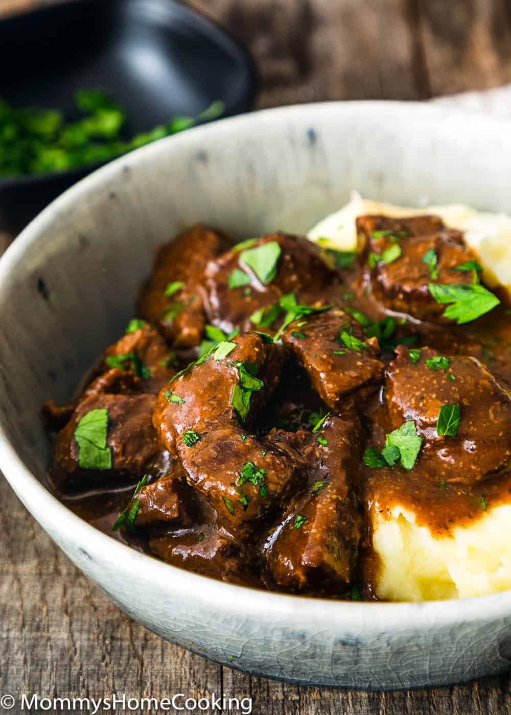  Beef Tips and mashed potatoes garnished with chopped parsley