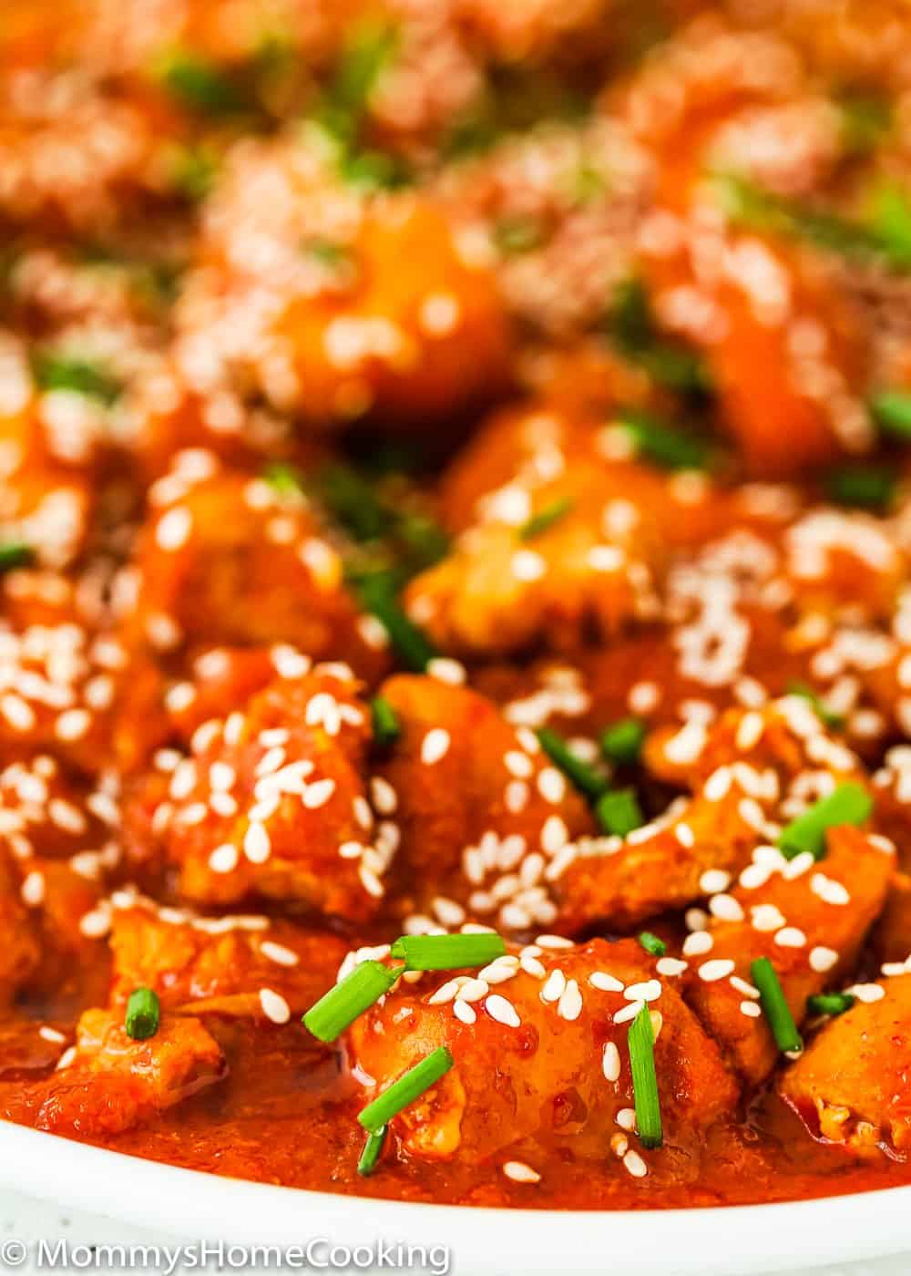 easy and tender Instant Pot Korean Kimchi Chicken in a white plate