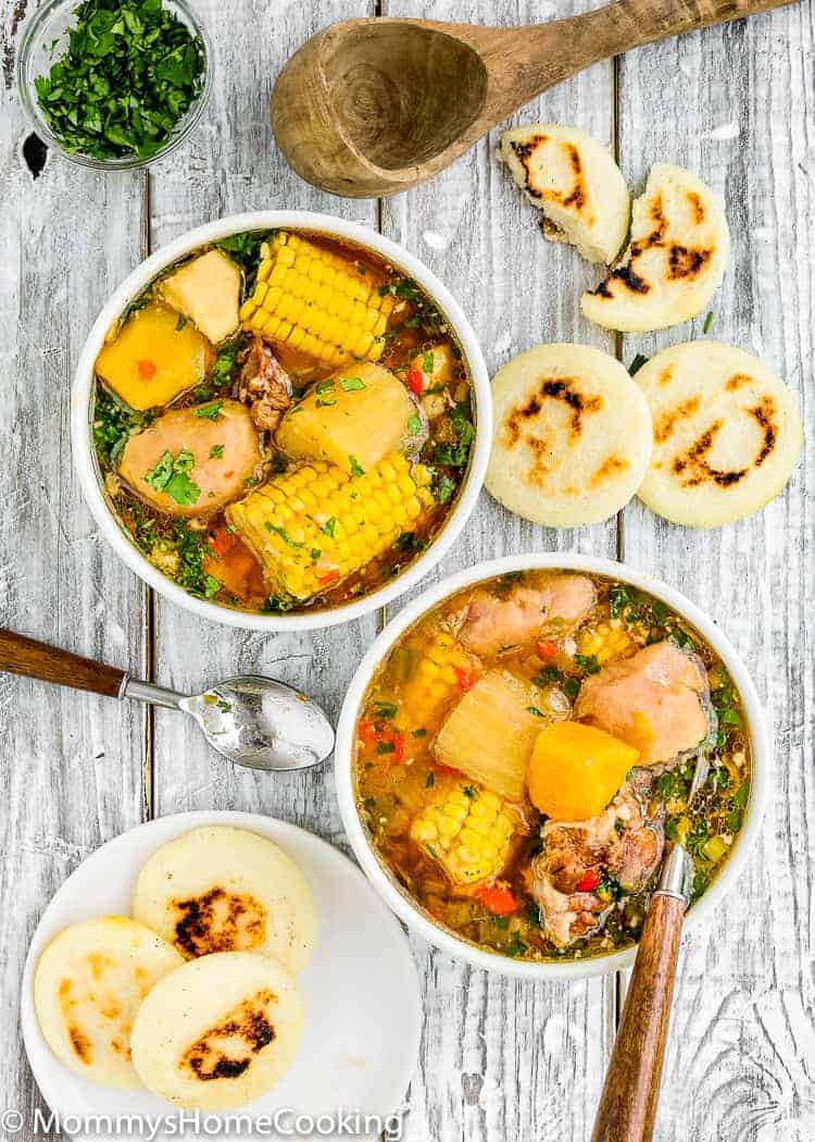 2 bowls with Venezuelan Oxtail Soup and arepas