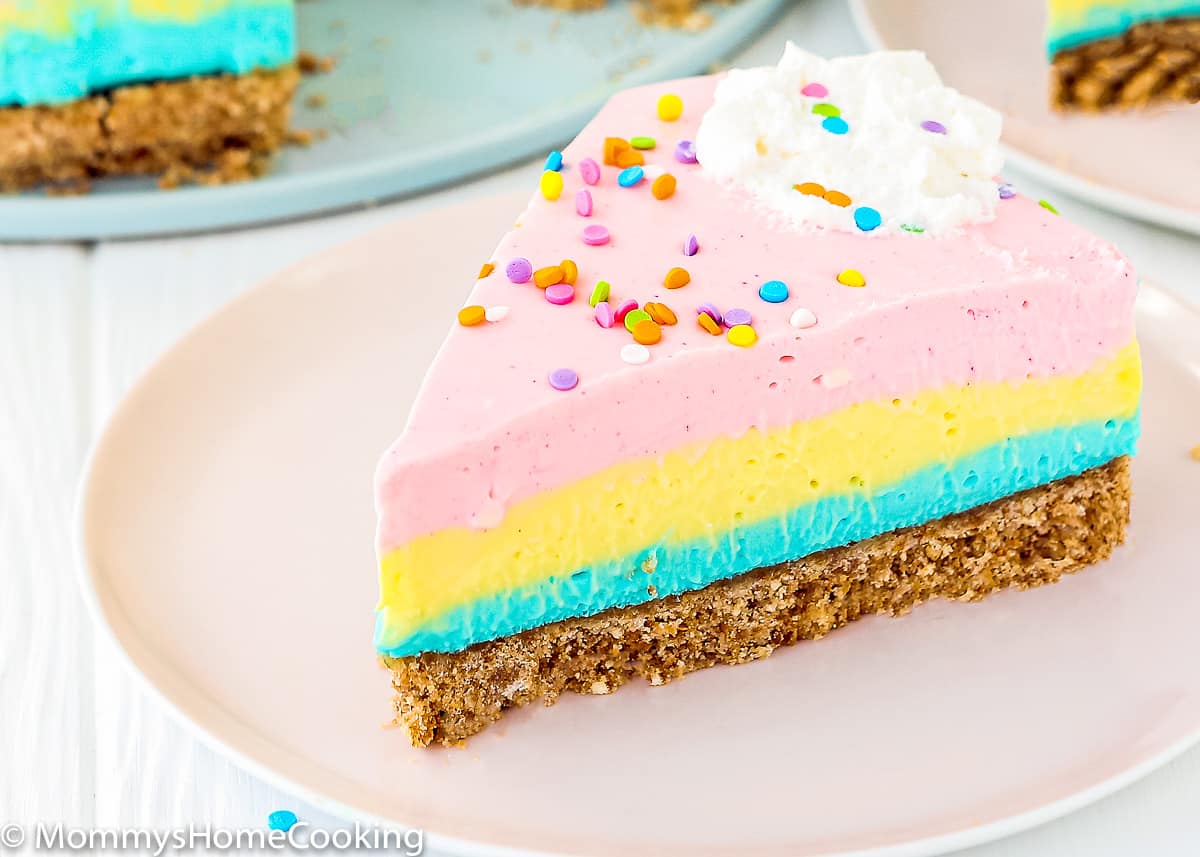 slice of no-bake easter cheesecake on a pink plate.